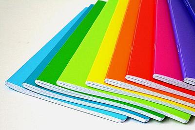 A pile of notebooks in different colours